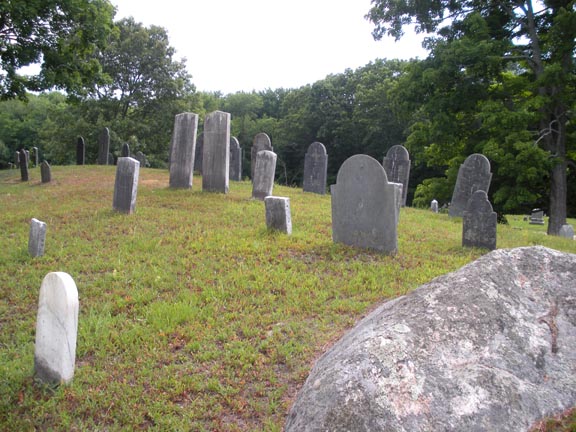A group of headstones on a hilltop