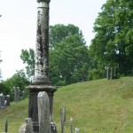 An obelisk enjoys a view of a hill