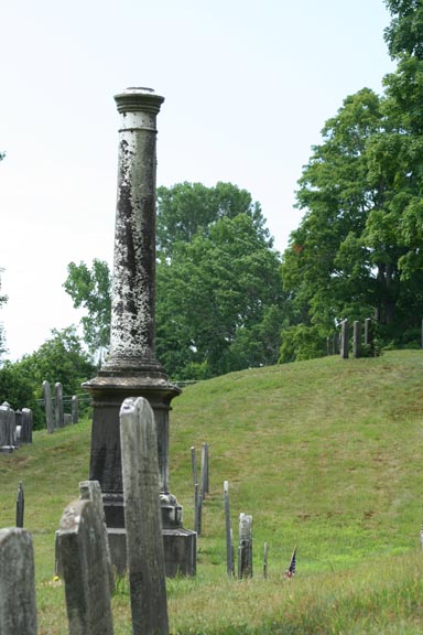An obelisk enjoys a view of a hill