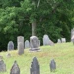 More styles of headstones on a hill