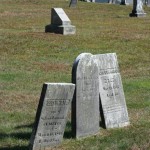3 headstones leaning in 3 different directions